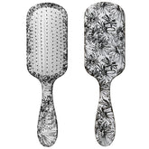 Conair Knot Dr detangler brush with a daisy print for smooth detangling on wet or dry hair