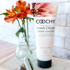 Coochy Shave Cream texture close-up shows creamy luster and glide