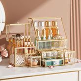 CoralHouse clear makeup organizer with gold frame on vanity for easy-access cosmetics.