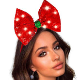 Coridy light up headband with red bow adds festive sparkle for parties.