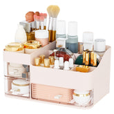 Cq Acrylic pink makeup organizer with three drawers keeps cosmetics neatly accessible.
