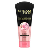 Cream Silk Triple Keratin Rescue bottle delivers anti-frizz hydration for smooth hair.