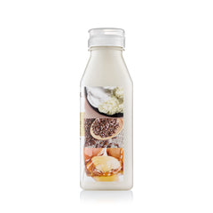 Creme of Nature detangling shampoo close-up highlights conditioning glow from argan oil.