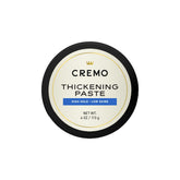 Cremo hair thickening paste packshot highlighting barber-grade styling