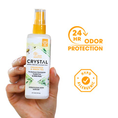 Crystal Essence Deodorant Spray mist showing pump action for quick refreshment