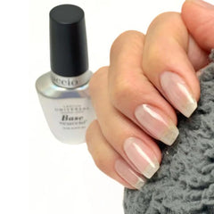 Cuccio Builder brush applying shape and structure to natural nails.