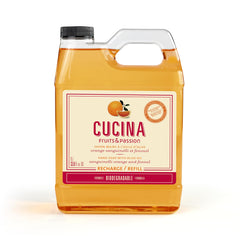 Cucina Fruits & Passion hand soap refill bottle closeup, showing bright orange aroma for kitchen cleansing.