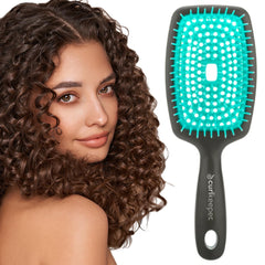 Curl Keeper Flexy Brush turquoise closeup shows flexible bristles for detangling.