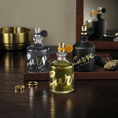 Curve Black for Men bottle side view hints at balanced citrus and woody notes.