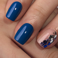 Close-up of Deep Blue gel-polish finish on nails for a glossy look