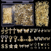 Cynailli 320pcs 3D nail charms collection closeup shows diverse gold designs for vibrant nail art.
