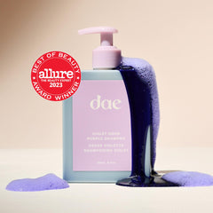 DAE Violet Hour Purple Shampoo lather demonstrates cleansing with brass-toning benefits.