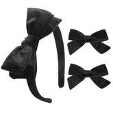 DEEKA Black Velvet Bow Headband close-up showing luxe texture for polished school uniforms