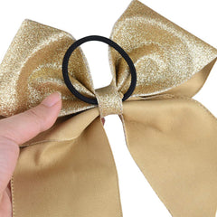 DEEKA ponytail holder bow demonstrates secure elastic for all-day wear
