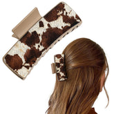 DEEKA real leather western clip closeup shows cowprint texture for secure styling