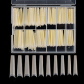 Defuber tapered extra long nail tips in the clear box for easy selection.