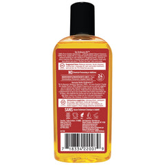 Desert Essence Jojoba Oil on hair application for lightweight conditioning.
