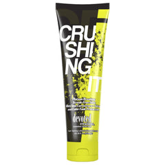 Devoted Creations Crushing It dark tanning lotion bottle showing smooth, bronzing potential.