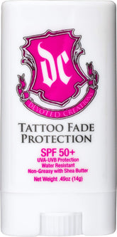 Devoted Creations tattoo fade protection stick with SPF 50+ and pink-blue cap.