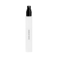 DIME Dans Les Bois bottle close-up highlighting portable luxury fragrance on the go