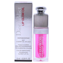 Dior Addict Lip Glow Oil raspberry tube close-up with glossy finish and nourished lips