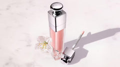 Dior Addict Lip Maximizer application shot highlights smooth lips and plumping effect.