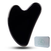 Ditind Gua Sha black obsidian face tool for relaxing facial massage and enhanced absorption.