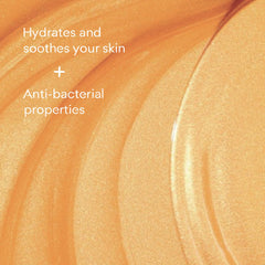 Doliderm Rituel de Miel honey shower oil pour close-up for moisturized skin.
