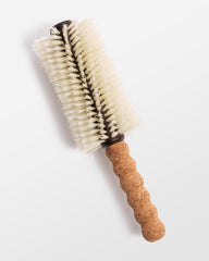 Dom Dom Big Papi boar-nylon bristle blend enables gentle detangling and smoothing.