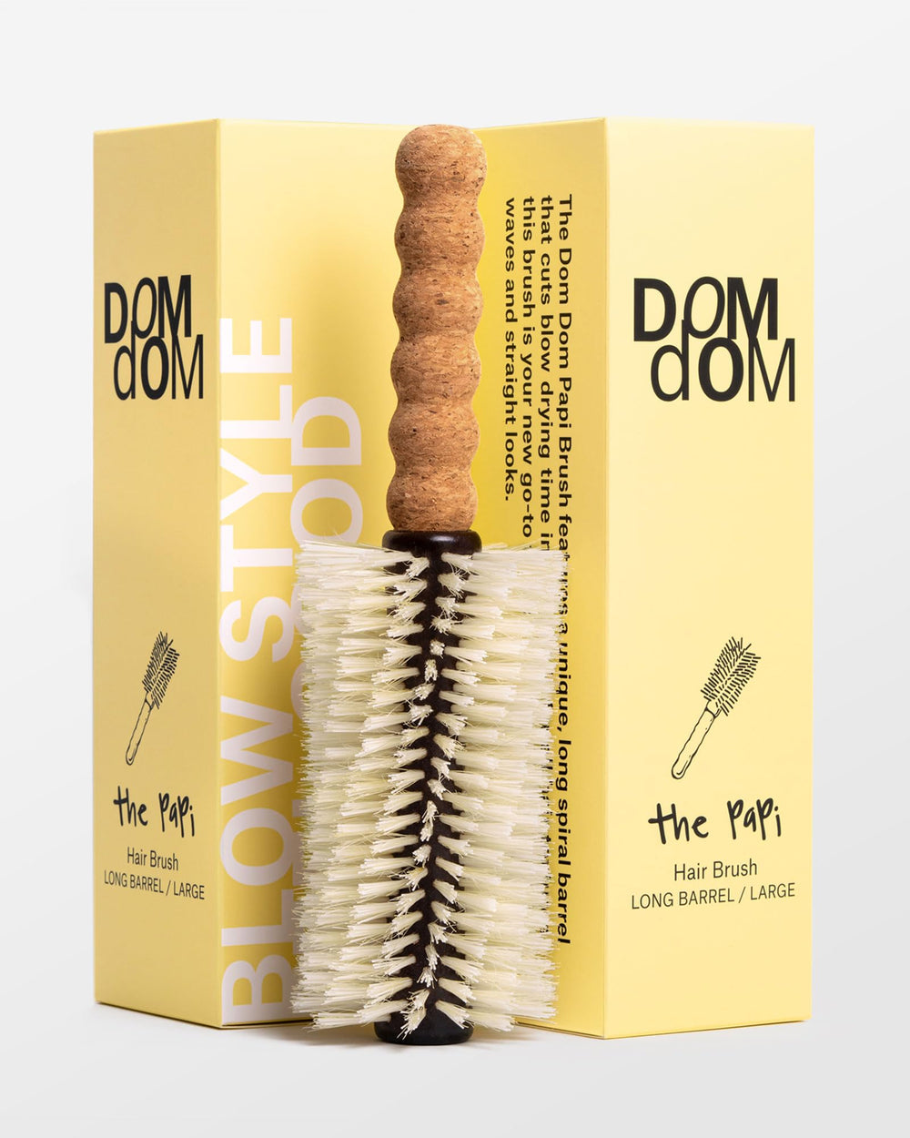 Dom Dom Big Papi long-barrel boar brush demonstrates premium bristles for faster drying.