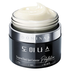 DOMINAS dark spot corrector bottle for targeted spot care and evening routine