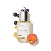 Dossier Fruity Honey bottle pour highlights bright nectarine notes for everyday freshness.