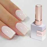 Double Rhythm front bottle view showing milky white shade and neat packaging benefit