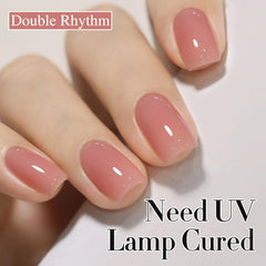 Double Rhythm jelly nail polish swatch shows translucent milky pink layer.