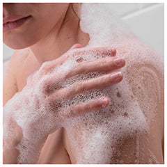 Dove Hydrate Body Wash being rinsed off, leaving refreshed, moisturized skin.