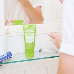 Dr. Bronner's Shikakai powder close-up highlights natural cleansing and skin-softening for shaving.