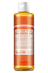 Dr. Bronner's Tea Tree Castile soap bottle pouring for versatile cleaning tasks