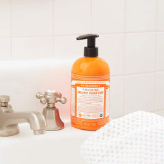 Dr. Bronner's tea tree soap foam close-up emphasizes gentle cleansing and fresh aroma.
