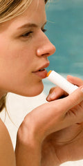 Dr. Hauschka lip care stick close-up reveals glossy, nourished lips.