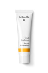 Dr Hauschka Tinted Day Cream 1oz bottle close-up showing natural glow and hydration.