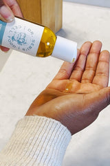 Dr. Sebi's Batana Oil ingredients with coconut and olive, emphasizing nourishing botanical oils.