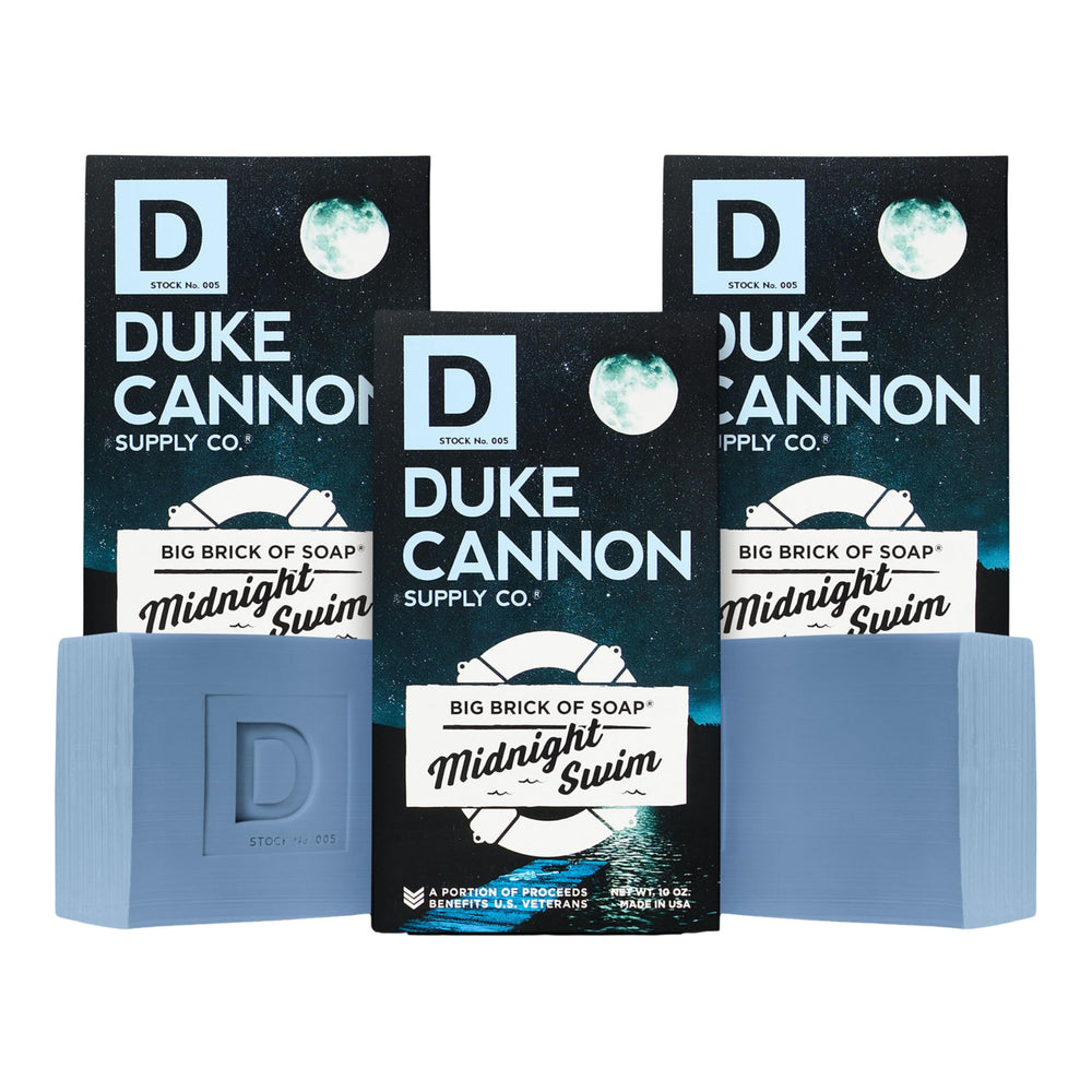 Duke Cannon Big Brick Midnight Swim bar close-up shows rich lather and lasting freshness.