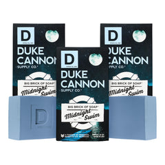 Duke Cannon Big Brick Midnight Swim bar close-up shows rich lather and lasting freshness.