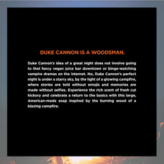 Duke Cannon big brick soap wooden surface image conveys rugged outdoor vibe and campfire mood