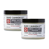 Duke Cannon News Anchor Pomade bottle closeup showing strong hold for camera-ready style.