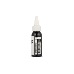 Dynamic Color Co. black tattoo ink being applied smoothly on skin.