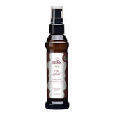 Earthly Body MKS Eco Hair Styling Elixir bottle close-up showing lightweight hydration for fine hair.