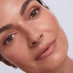 EarthsCure Glow Trio highlighter stick close-up for soft radiance.