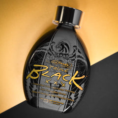 Ed Hardy Black XXX on skin during application for a fast, even tan look.