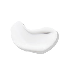 ELEVEN AUSTRALIA Keep My Curl Defining Cream close-up shows moisture for soft waves.